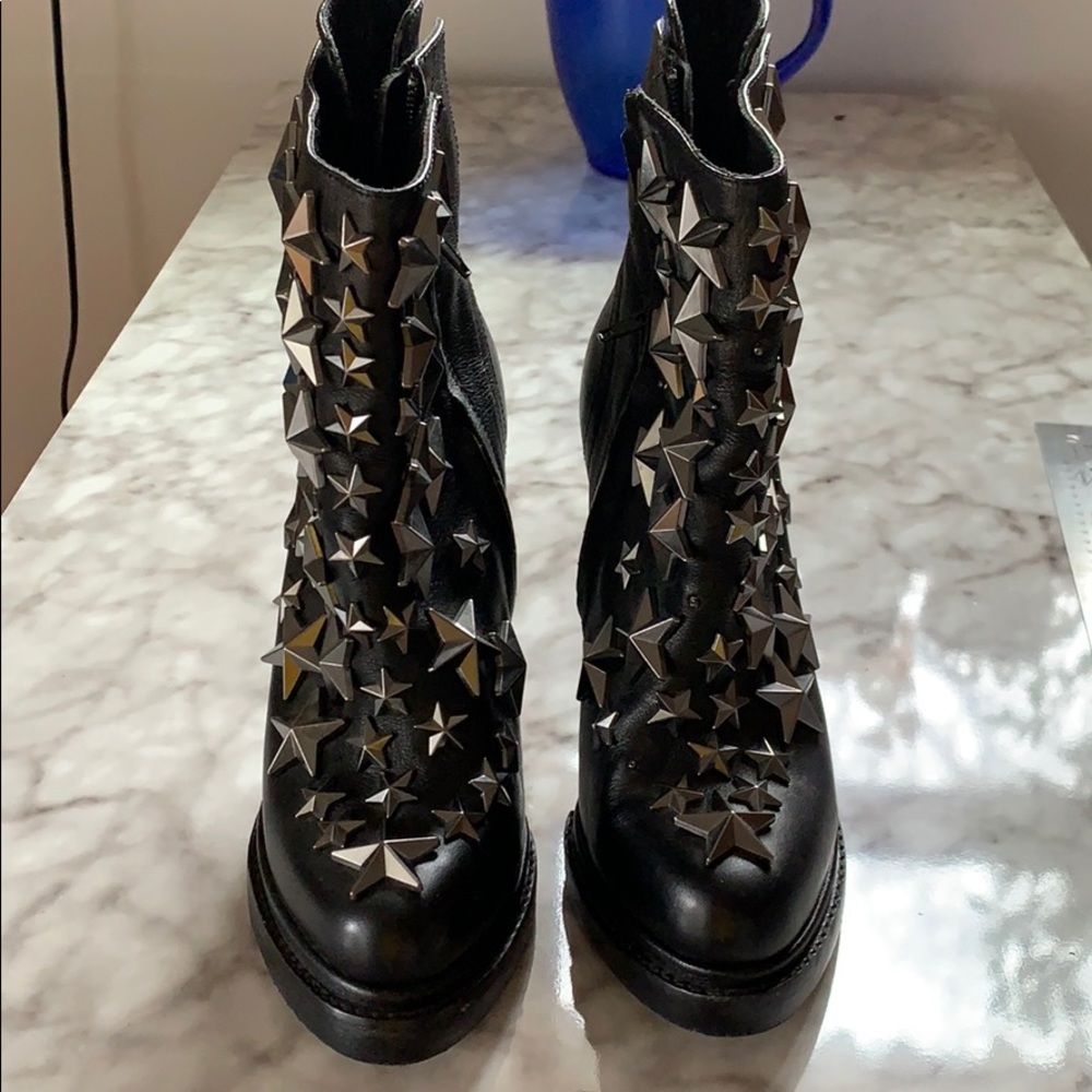 Black leather booties with metal stars